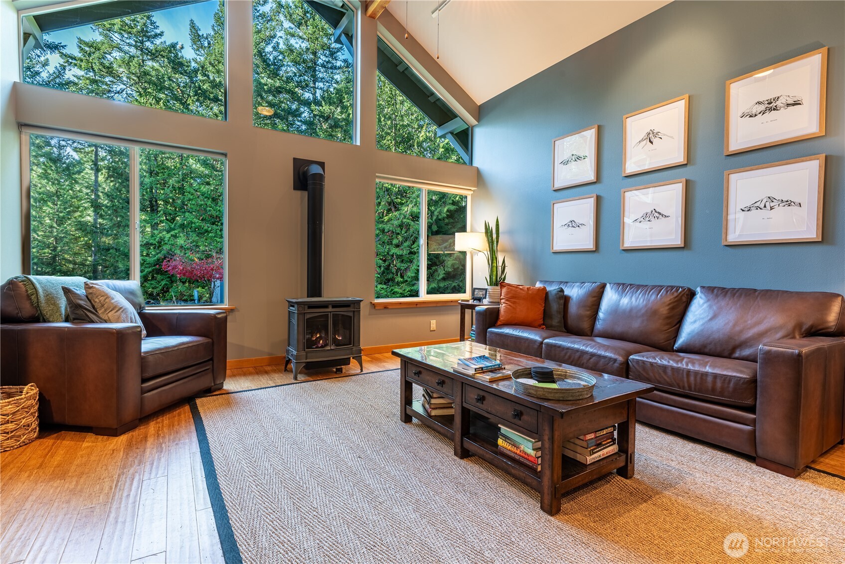 744 Tarte Road Friday Harbor, WA 98250 - Photo 4 of 35 a living room with furniture fireplace and large windows