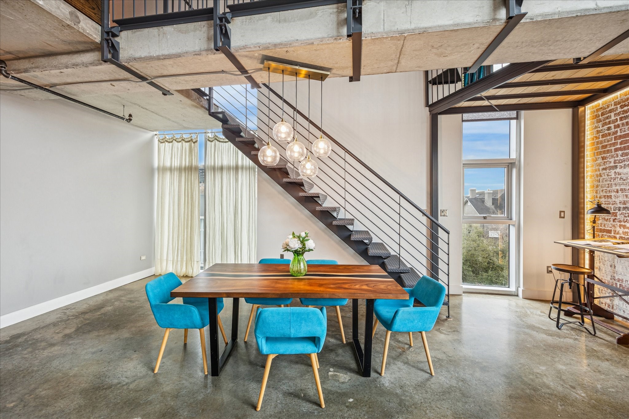 2000 Bagby Street, Unit 5400 Houston, TX 77002 - Photo 8 of 47 Spacious dining area featuring abundant natural light and a custom light fixture.