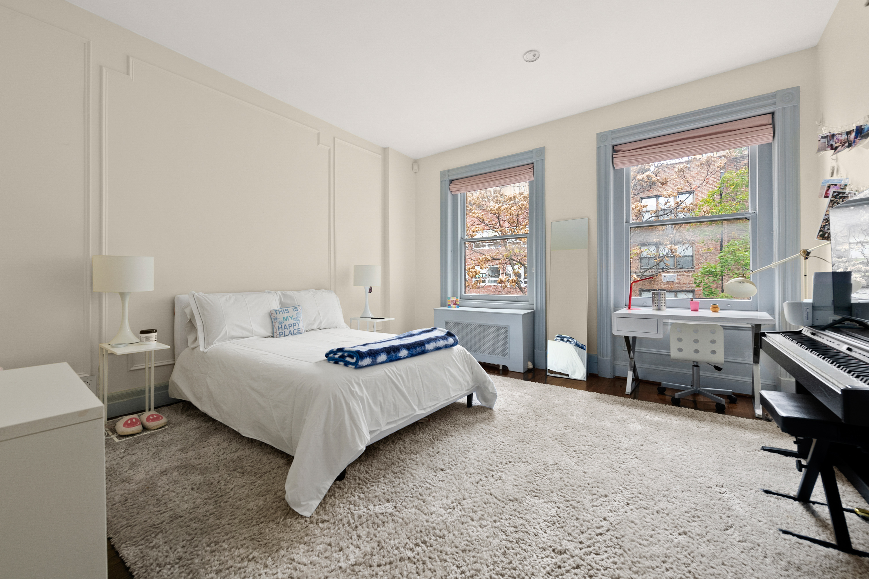 51 East 75th Street Manhattan, NY 10021 - Photo 18 of 22 a bedroom with a bed and a window