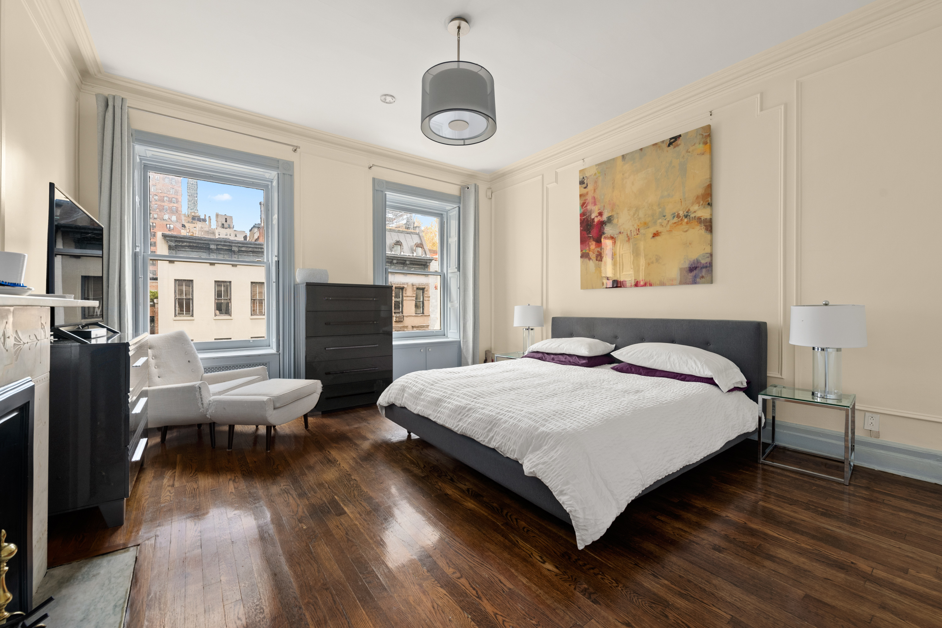 51 East 75th Street Manhattan, NY 10021 - Photo 19 of 22 a bedroom with bed and wooden floor
