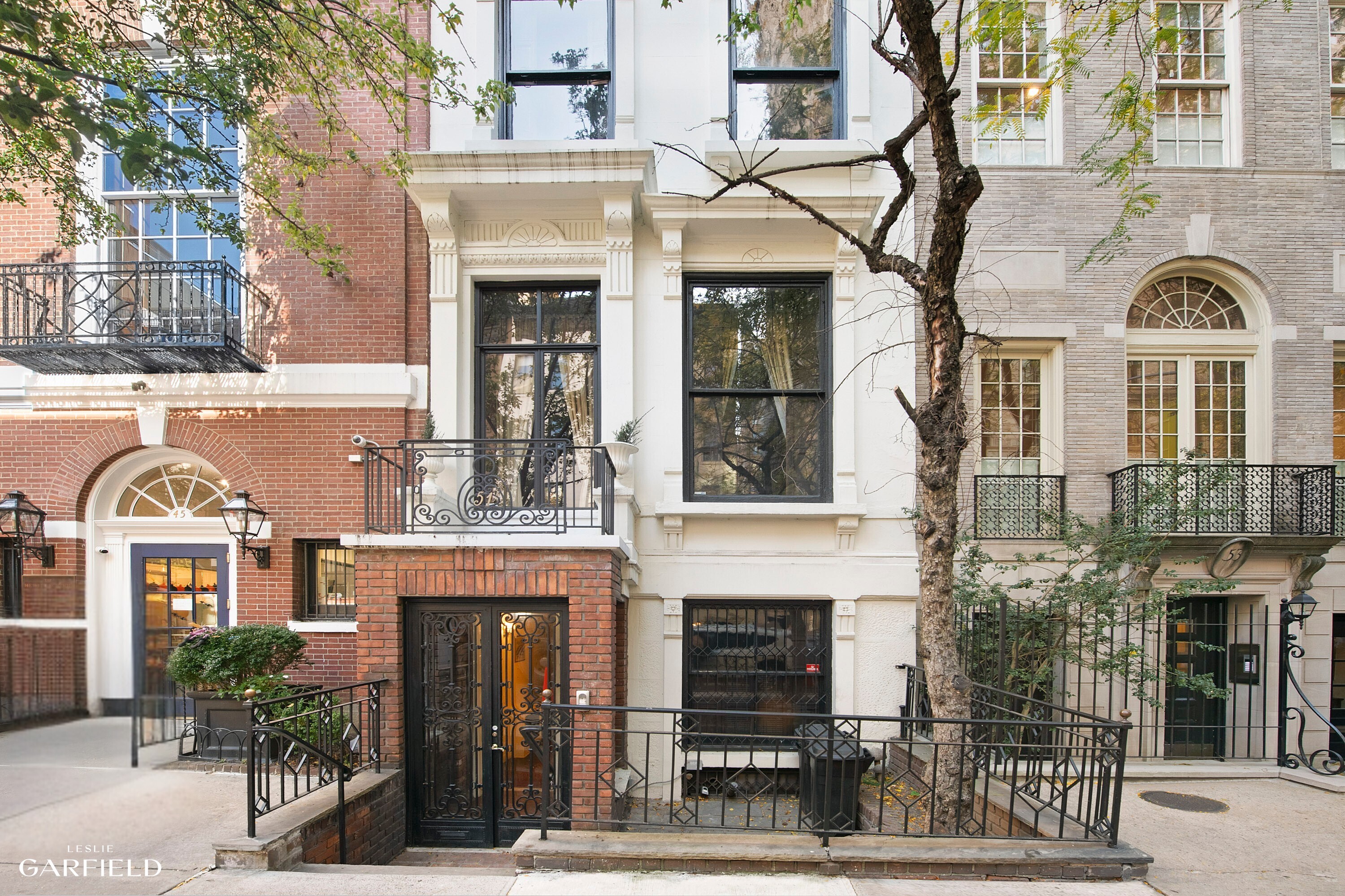 a front view of a house with large windows