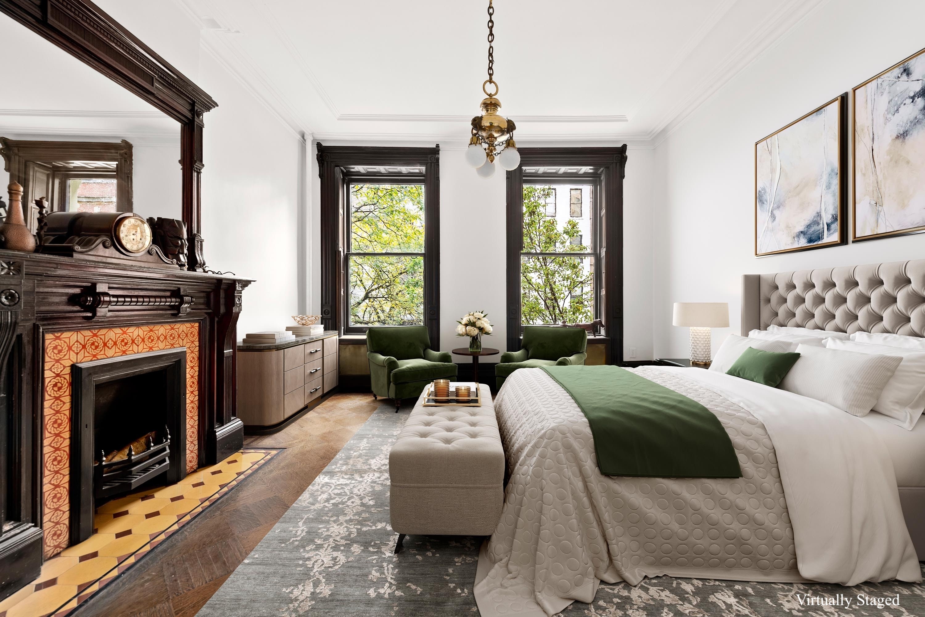 51 East 75th Street Manhattan, NY 10021 - Photo 9 of 22 a spacious bedroom with a balcony a bed and a fireplace