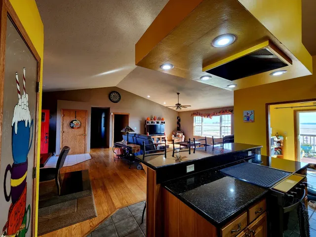 a view of a workspace with furniture window and a chandelier