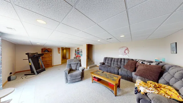 a front view of house with yard and trees