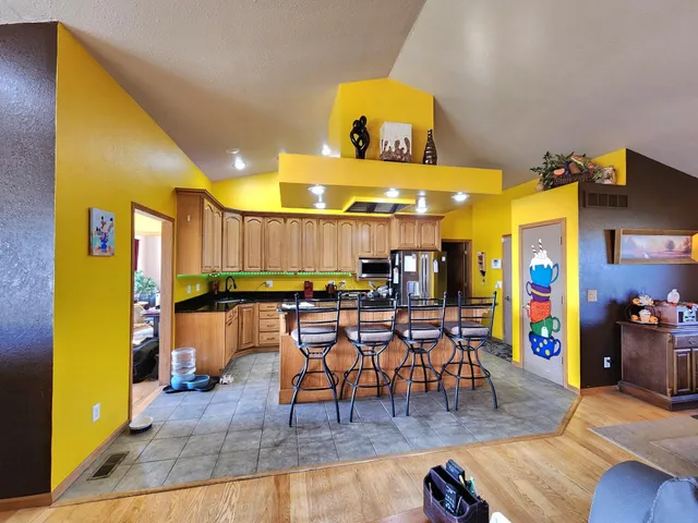 a view of a dining area with lots of furniture and lots of wooden furniture