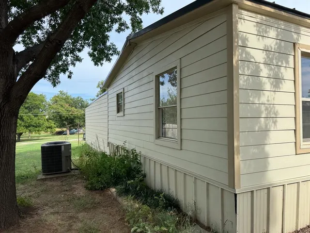 a view of empty room with windows