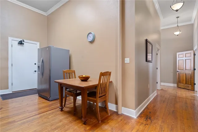 a view of a dining area with furniture and wooden floor