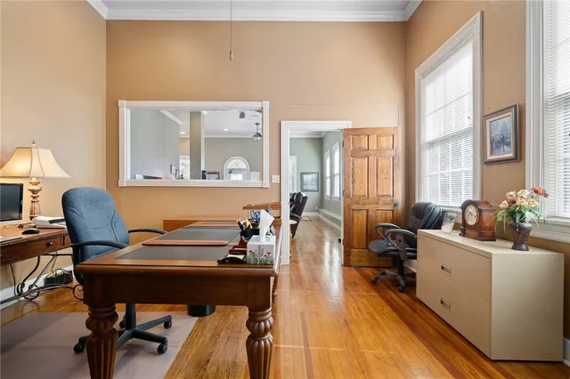 a living room with furniture and a piano