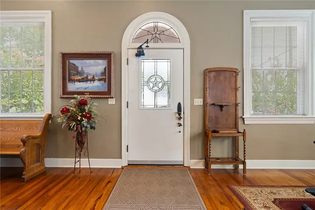 a view of a livingroom with furniture window and front door
