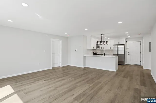 a view of kitchen with wooden floor