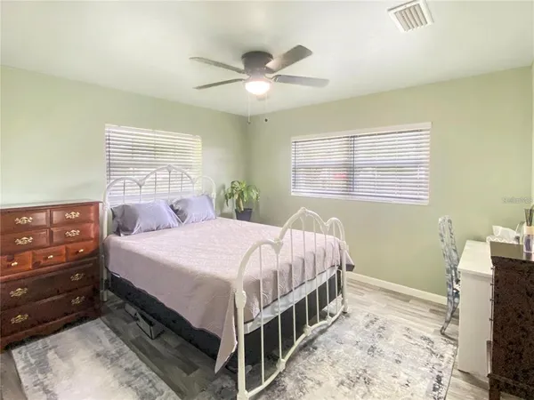 a bedroom with a bed and a dresser