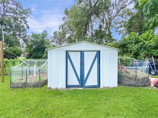 a view of a back yard of the house