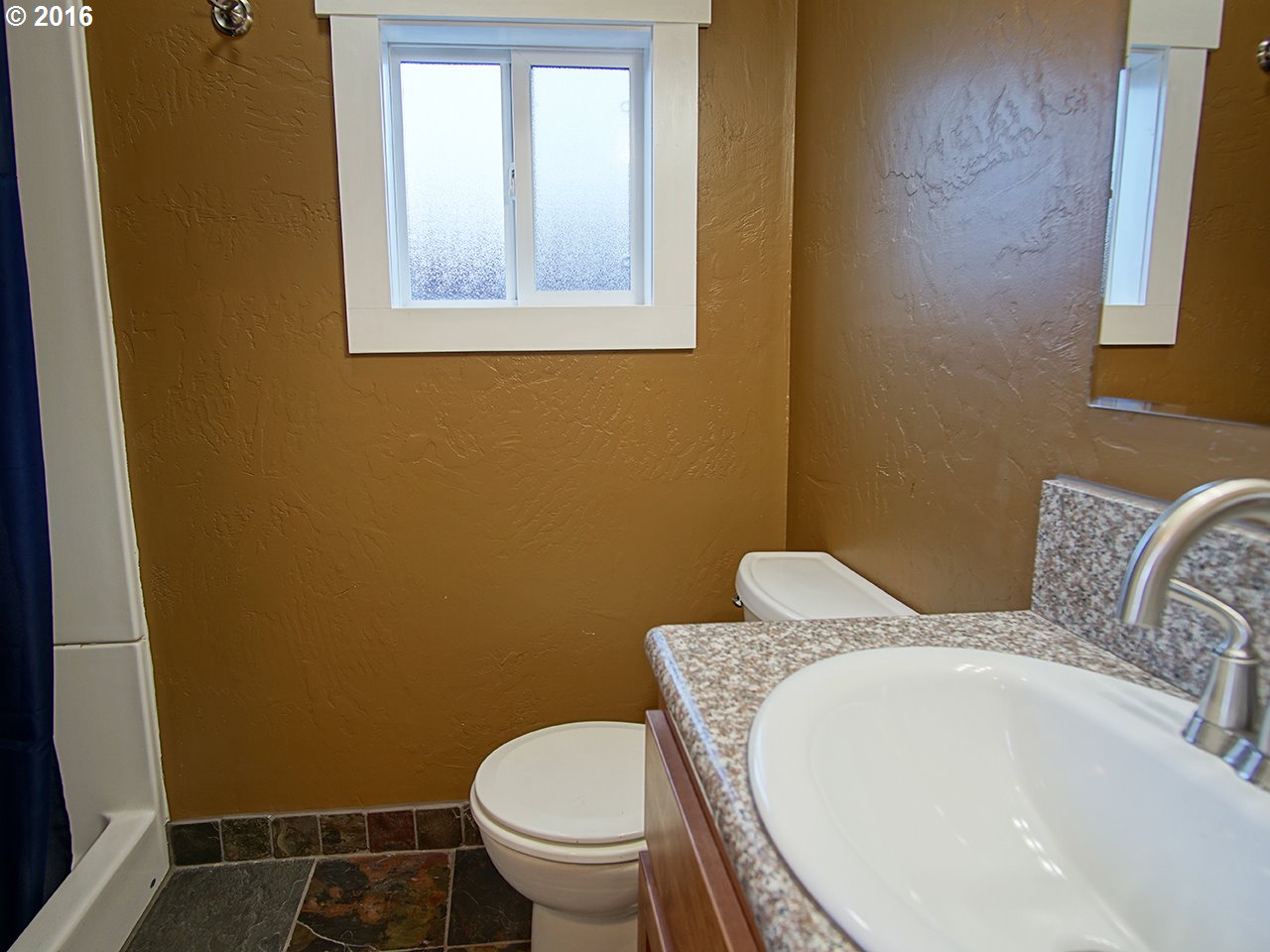 290 25th Street Springfield, OR 97477 - Photo 14 of 25 a bathroom with a toilet and a sink