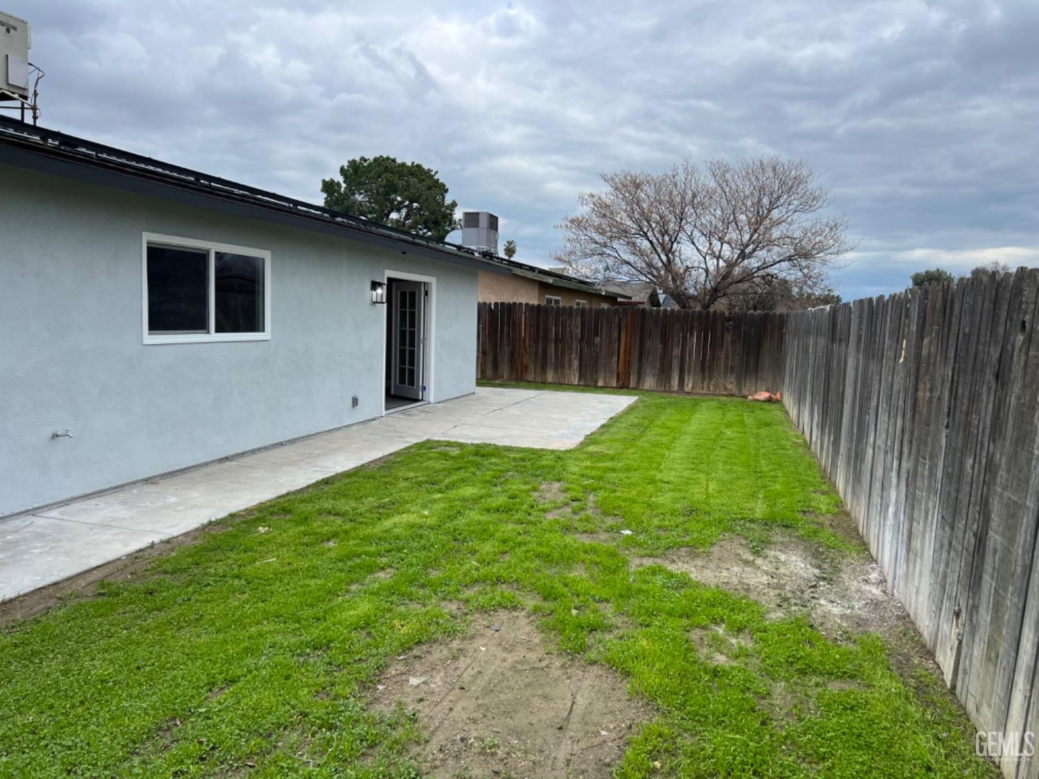 Undisclosed Address Bakersfield, CA 93308 - Photo 15 of 17 a backyard of a house with lots of green space