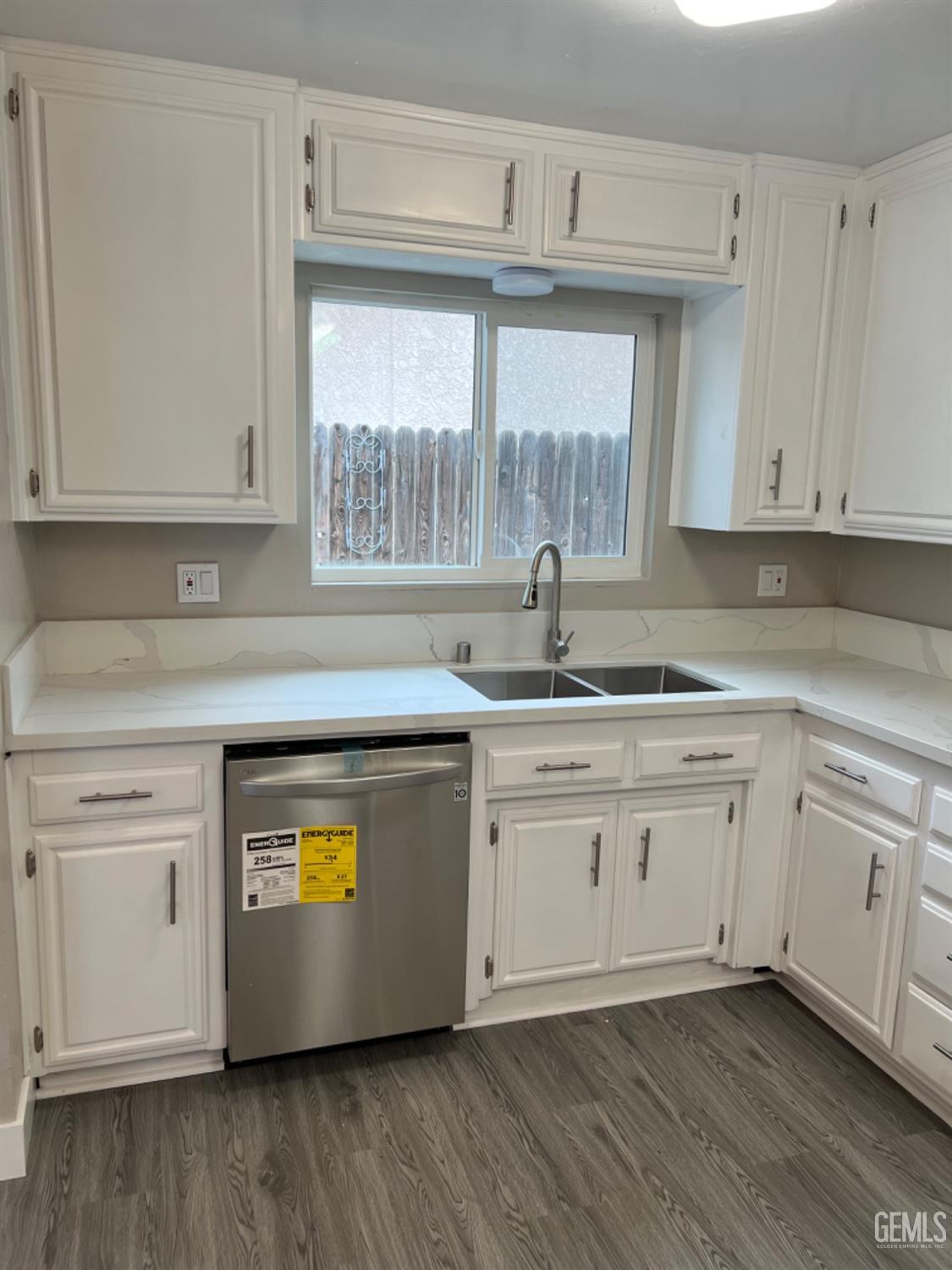Undisclosed Address Bakersfield, CA 93308 - Photo 7 of 17 a kitchen with stainless steel appliances granite countertop a sink a stove and a white cabinets