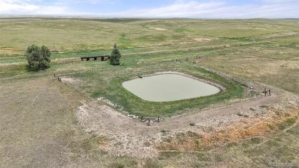 a view of a lake with a yard