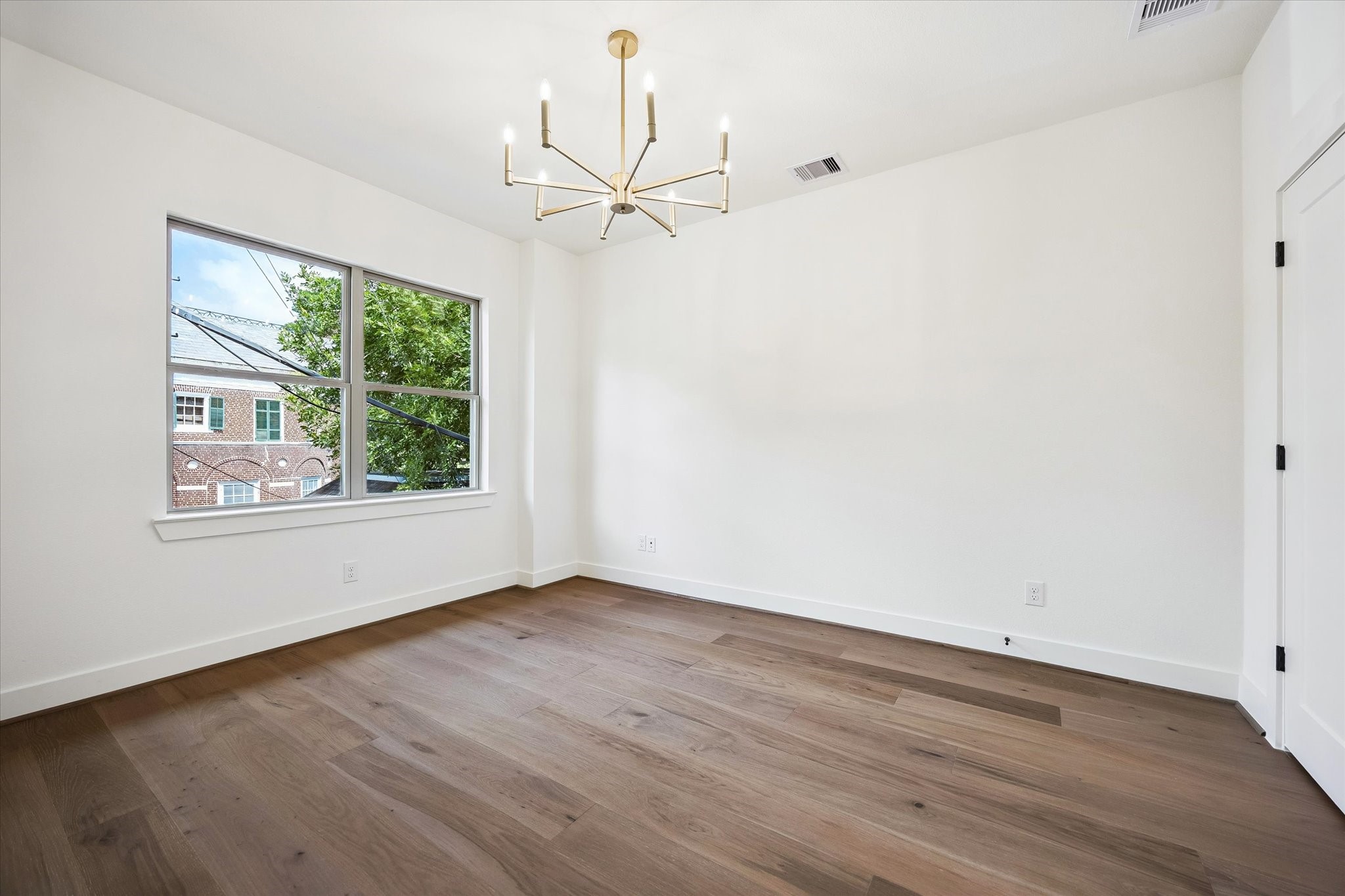5329 Dora Street Houston, TX 77005 - Photo 31 of 43 A versatile bonus room on the second level offers endless possibilities—perfect as a home office, fitness studio, media room, playroom, or additional living space tailored to your lifestyle.