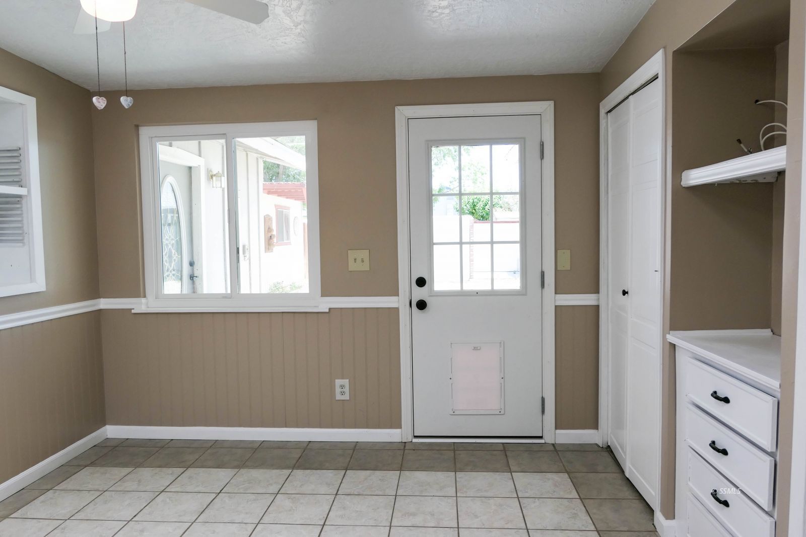 420 North Fairview Street Ridgecrest, CA 93555 - Photo 19 of 48 a view of an empty room with window and cabinet area