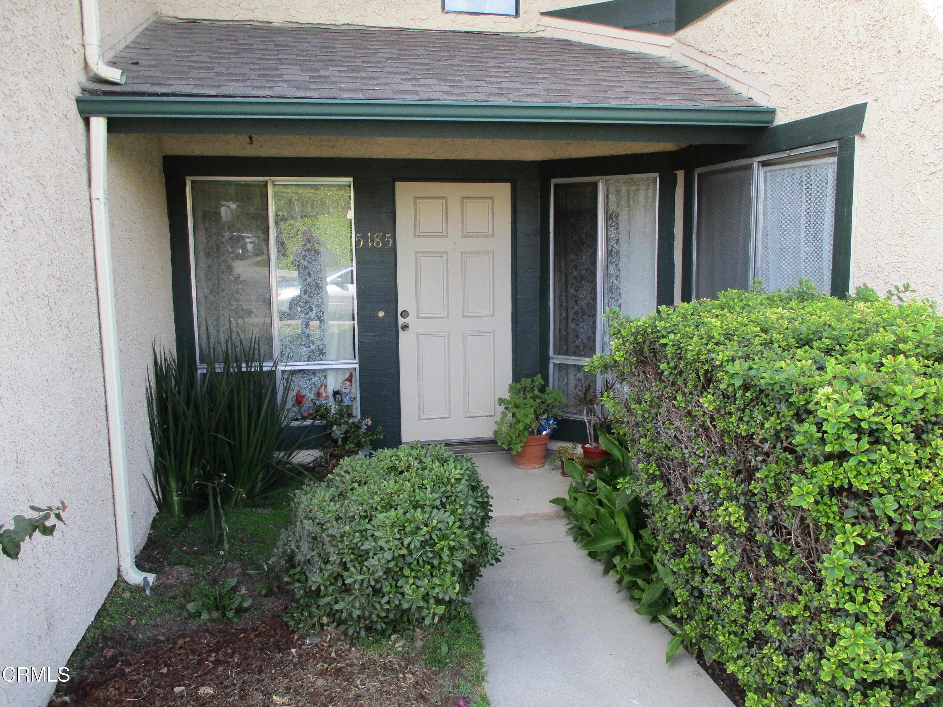 5185 Perkins Road Oxnard, CA 93033 - Photo 1 of 3 a view of a pathway besides a house