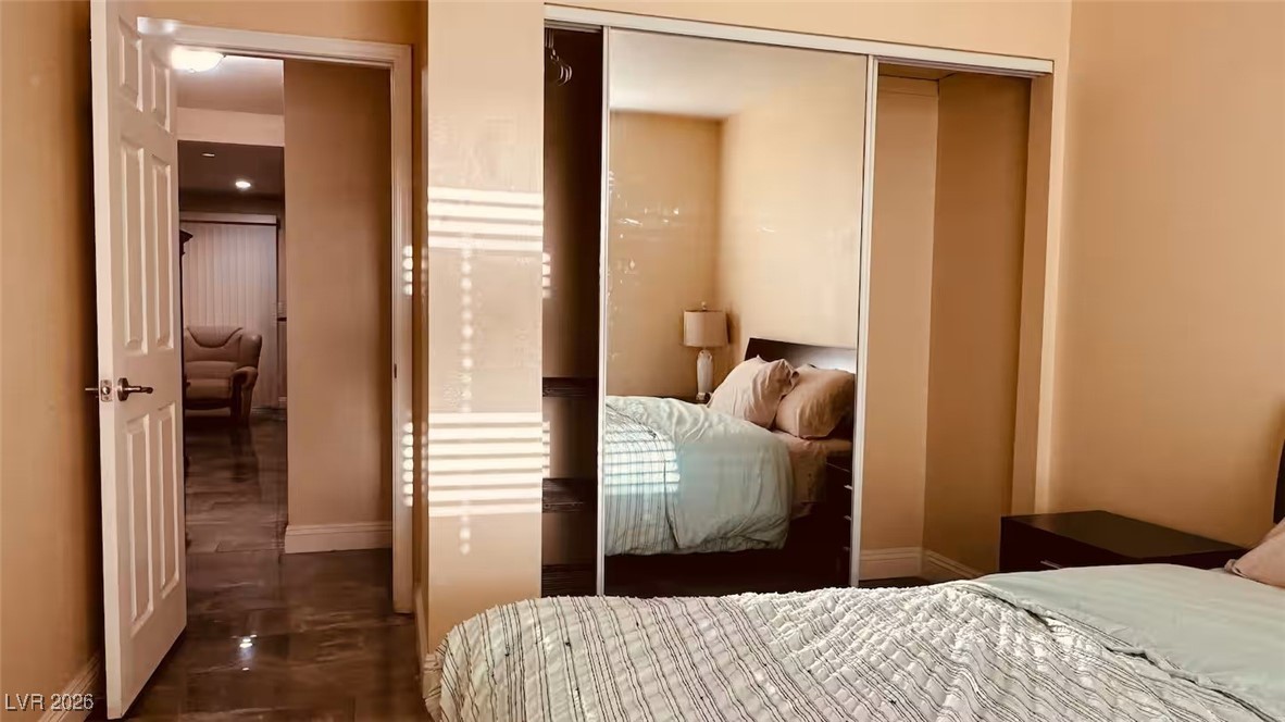 7300 West Pirates Cove Road, Unit 1039 Las Vegas, NV 89145 - Photo 27 of 30 Bedroom with baseboards