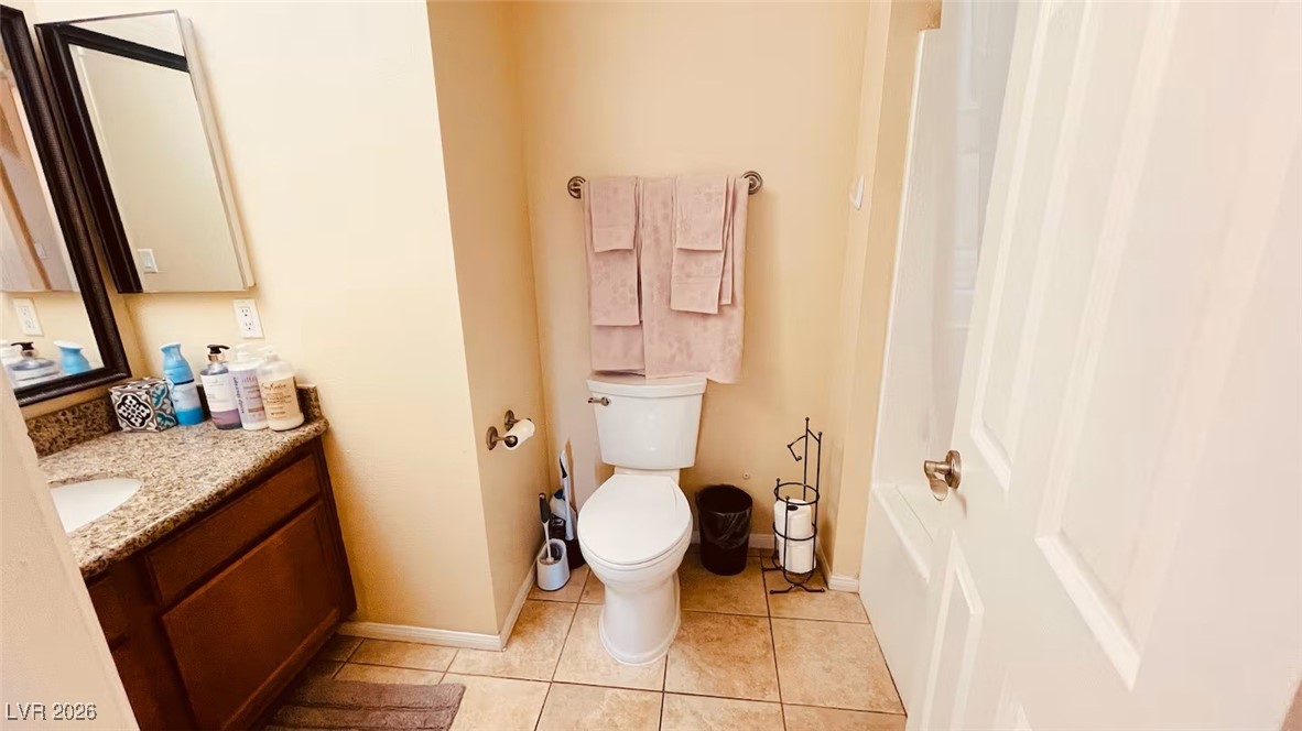7300 West Pirates Cove Road, Unit 1039 Las Vegas, NV 89145 - Photo 28 of 30 Full bath with vanity, light tile patterned floors, and shower / bath combo