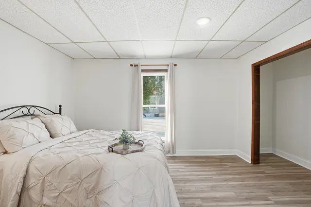 a bedroom with a bed and a window