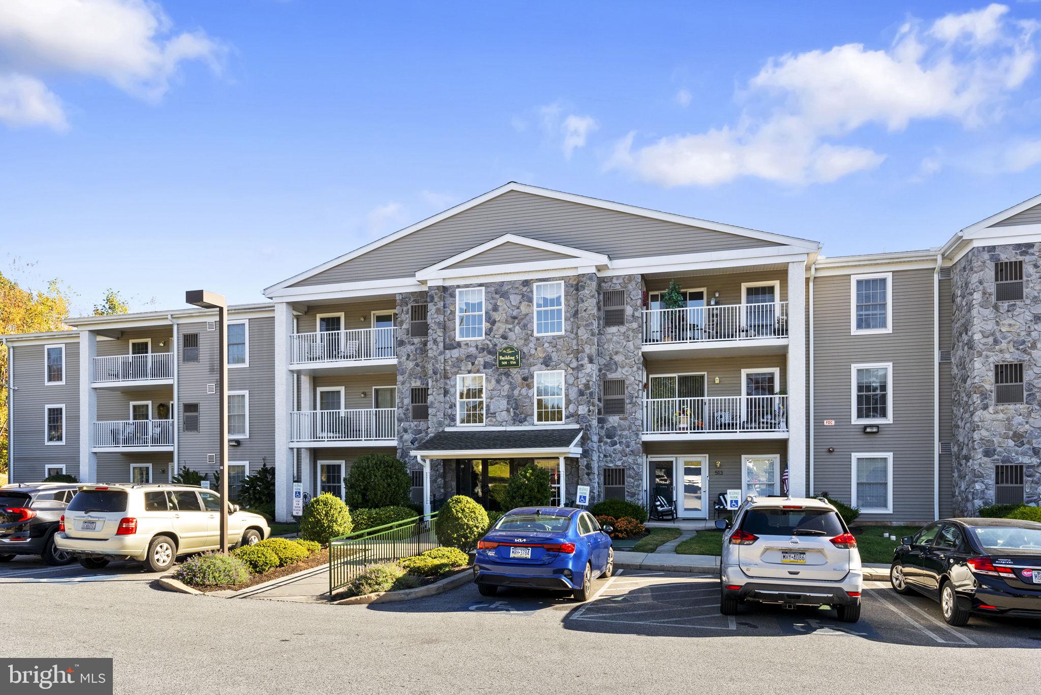 533 Brandon Road Eagleville, PA 19403 - Photo 1 of 32 a car parked in front of a building on the street