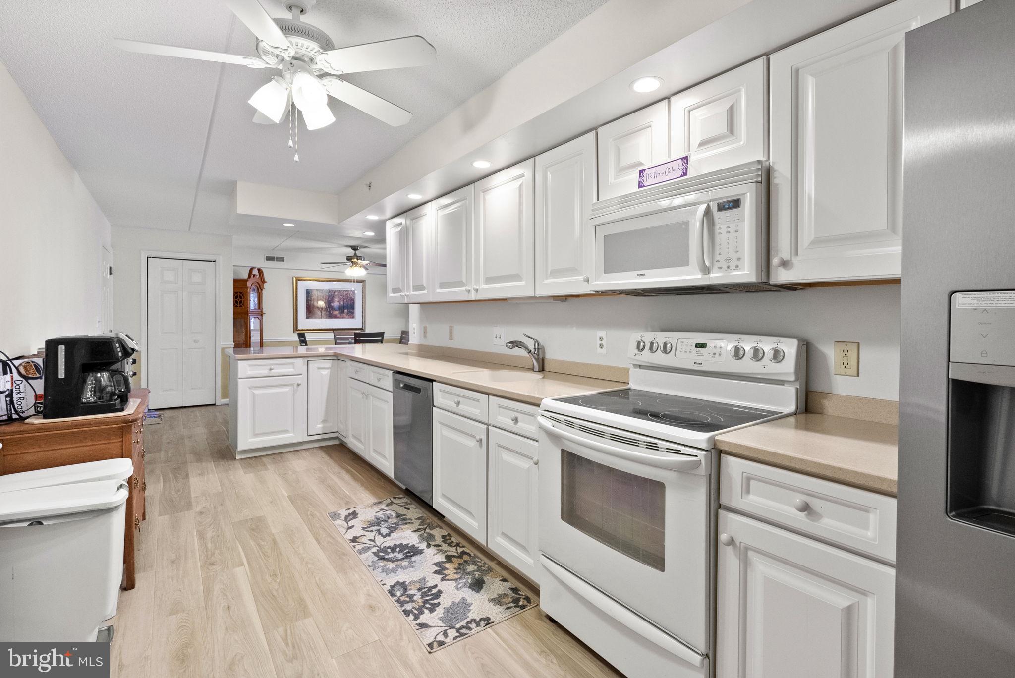 533 Brandon Road Eagleville, PA 19403 - Photo 16 of 32 a kitchen with cabinets wooden floor and stainless steel appliances