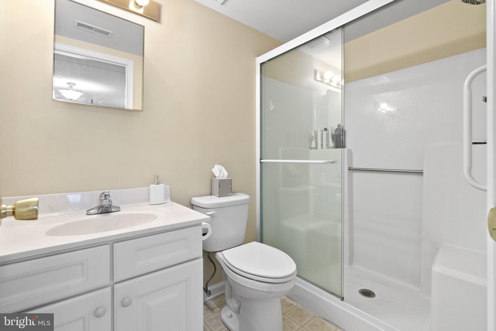533 Brandon Road Eagleville, PA 19403 - Photo 19 of 32 a bathroom with a sink mirror vanity and toilet