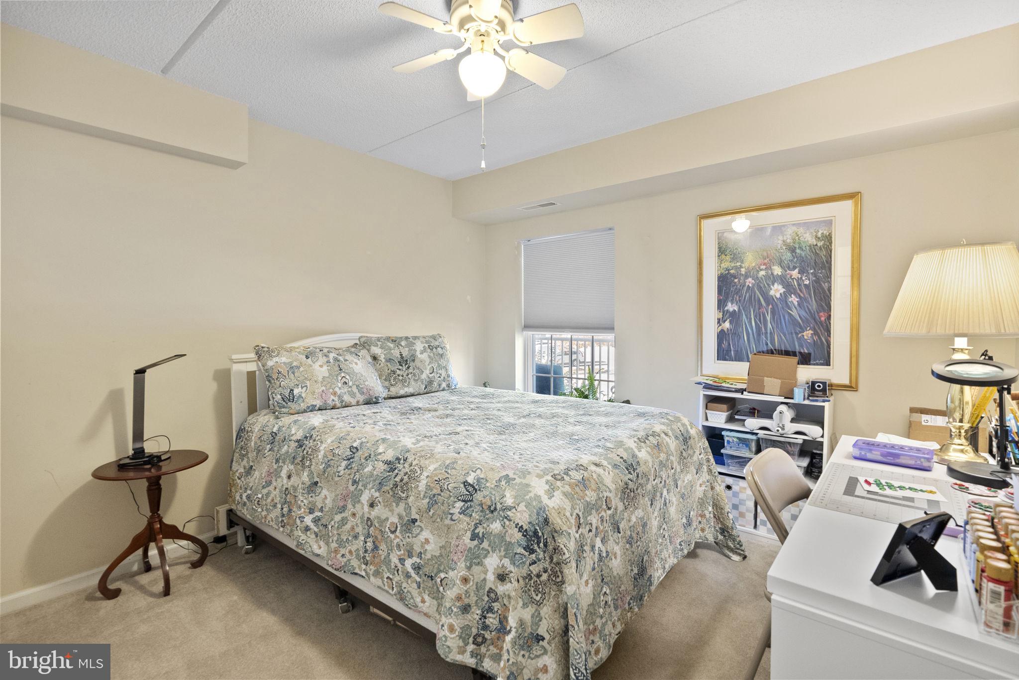 533 Brandon Road Eagleville, PA 19403 - Photo 20 of 32 a bedroom with a bed and a chandelier