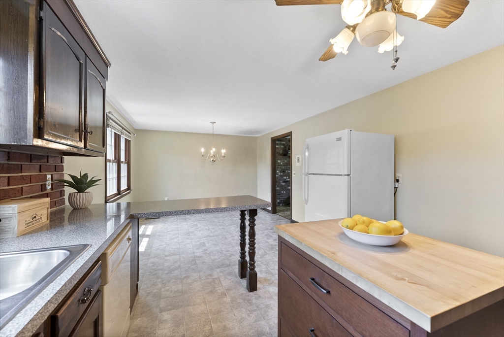 297 Granby Road Chicopee, MA 01013 - Photo 11 of 40 a kitchen with stainless steel appliances granite countertop a sink a stove and a refrigerator