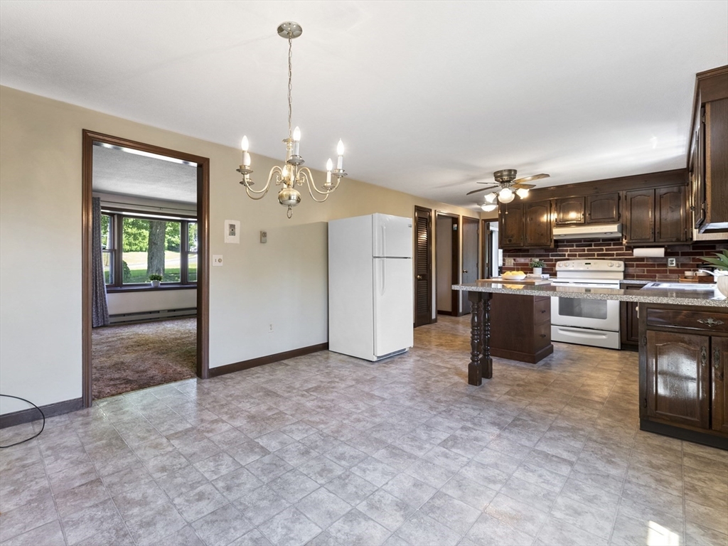 297 Granby Road Chicopee, MA 01013 - Photo 13 of 40 a view of a kitchen with refrigerator and windows
