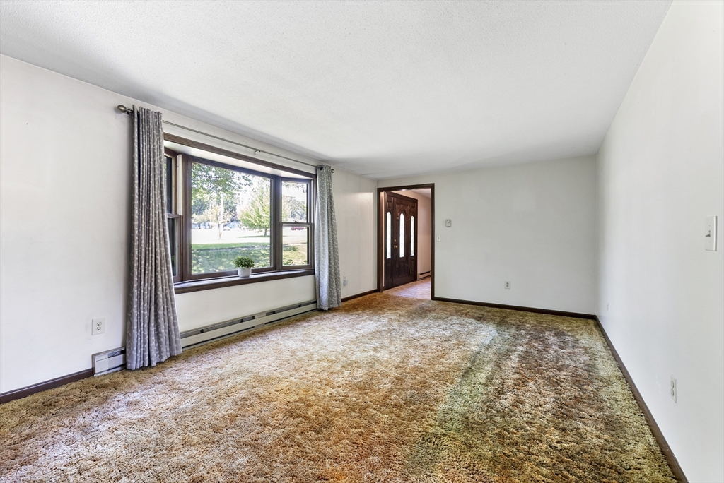 297 Granby Road Chicopee, MA 01013 - Photo 18 of 40 an empty room with windows