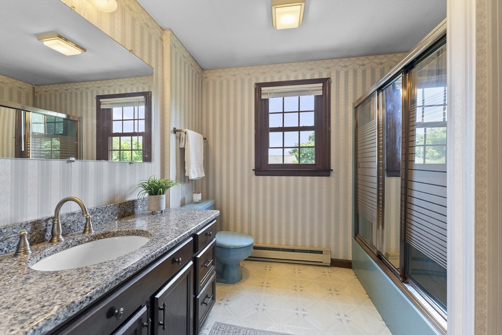 297 Granby Road Chicopee, MA 01013 - Photo 20 of 40 a kitchen with granite countertop a sink and a stove top oven