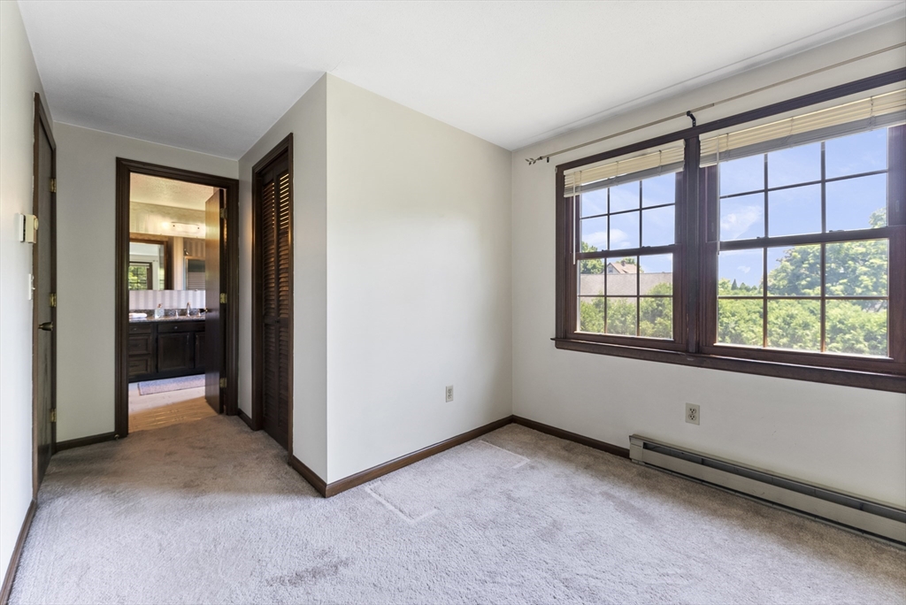 297 Granby Road Chicopee, MA 01013 - Photo 21 of 40 a view of an empty room with a window