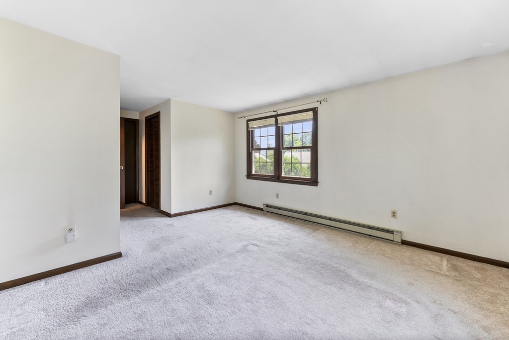 297 Granby Road Chicopee, MA 01013 - Photo 22 of 40 an empty room with windows and closet
