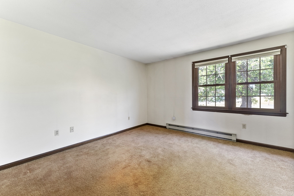 297 Granby Road Chicopee, MA 01013 - Photo 25 of 40 an empty room with a window