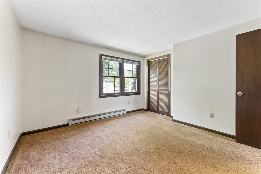 297 Granby Road Chicopee, MA 01013 - Photo 26 of 40 an empty room with windows