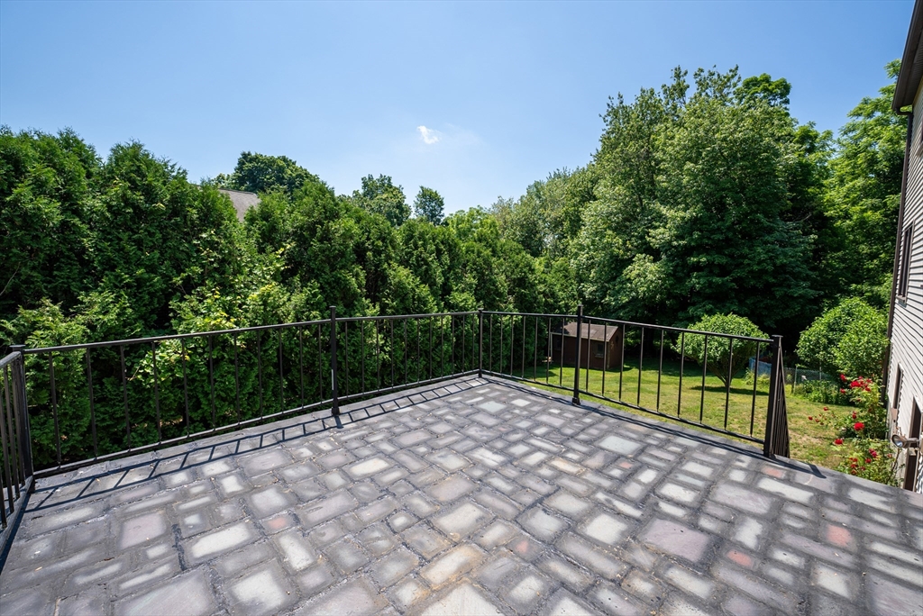 297 Granby Road Chicopee, MA 01013 - Photo 38 of 40 a view of a backyard with a small yard