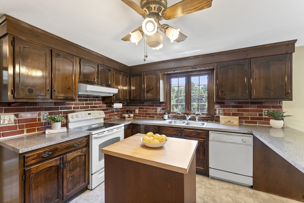 297 Granby Road Chicopee, MA 01013 - Photo 9 of 40 a kitchen with a sink stove and cabinets