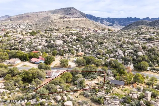 an aerial view of residential house and green space