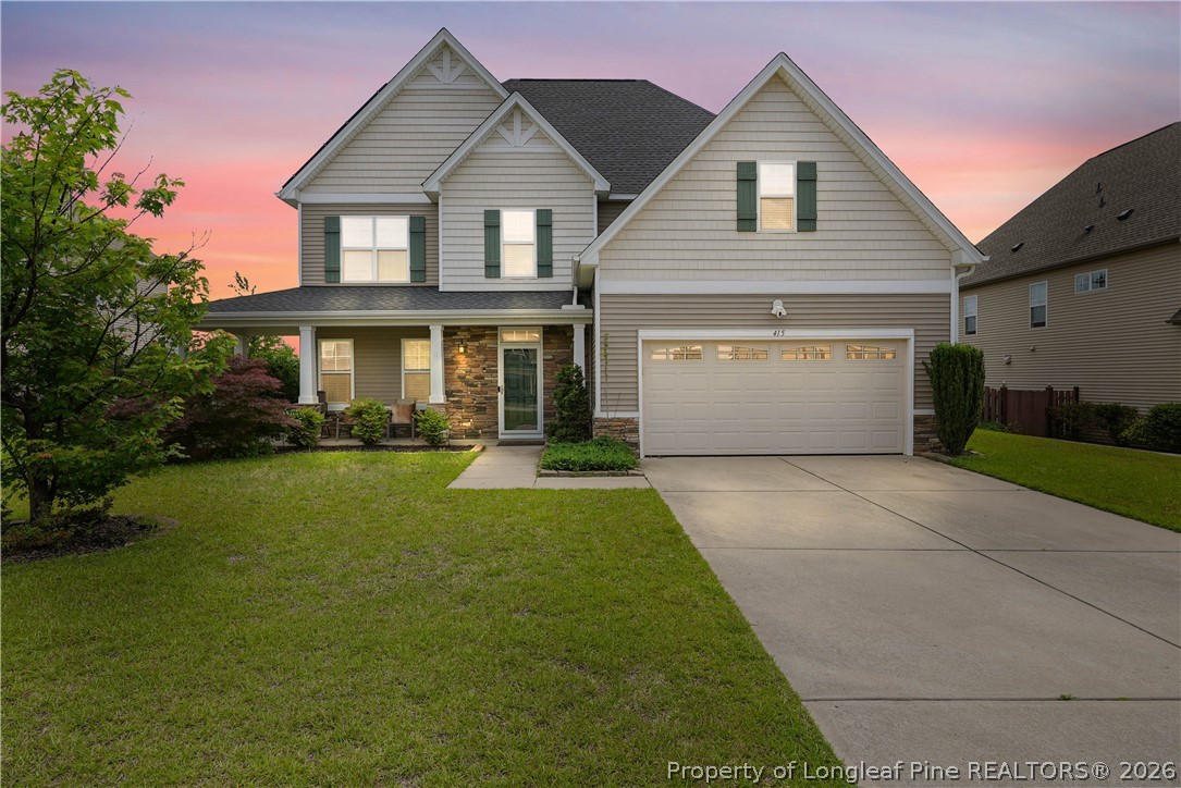 415 Highgrove Drive Spring Lake, NC 28390 - Photo 1 of 39 a front view of a house with swimming pool having outdoor seating