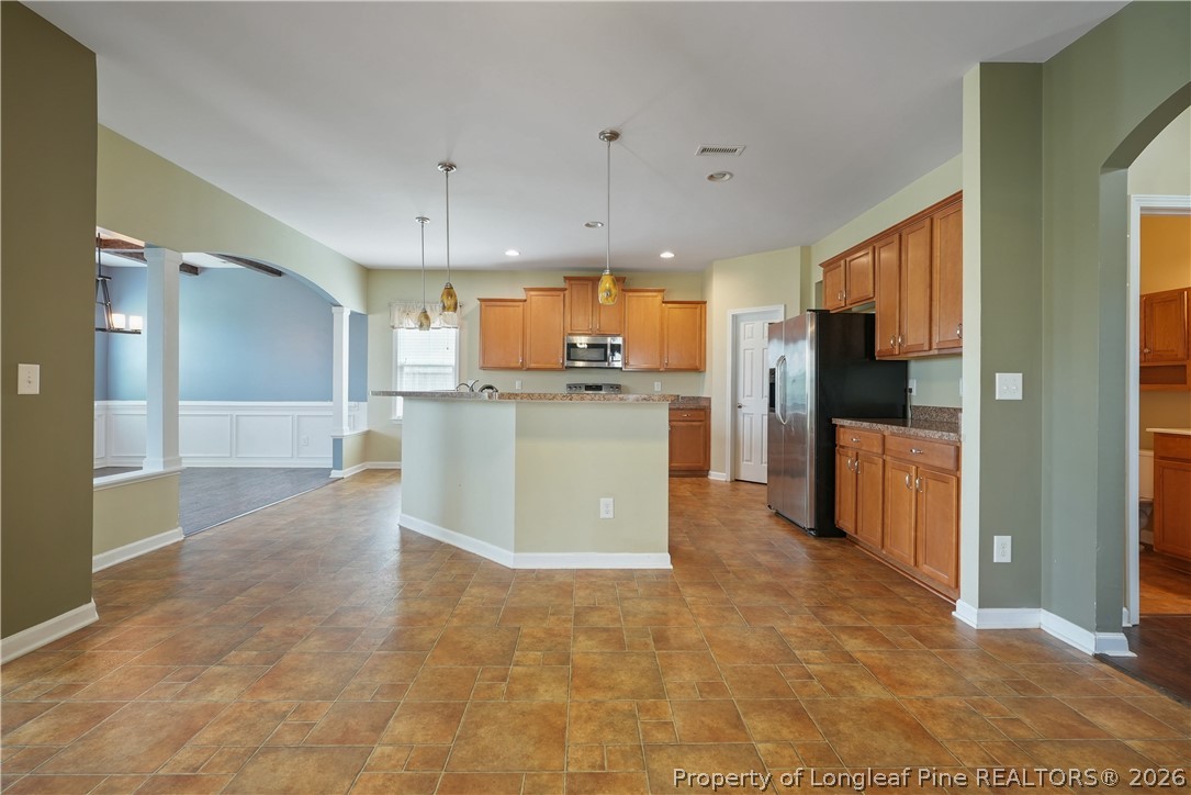 415 Highgrove Drive Spring Lake, NC 28390 - Photo 11 of 39 a kitchen with refrigerator and microwave