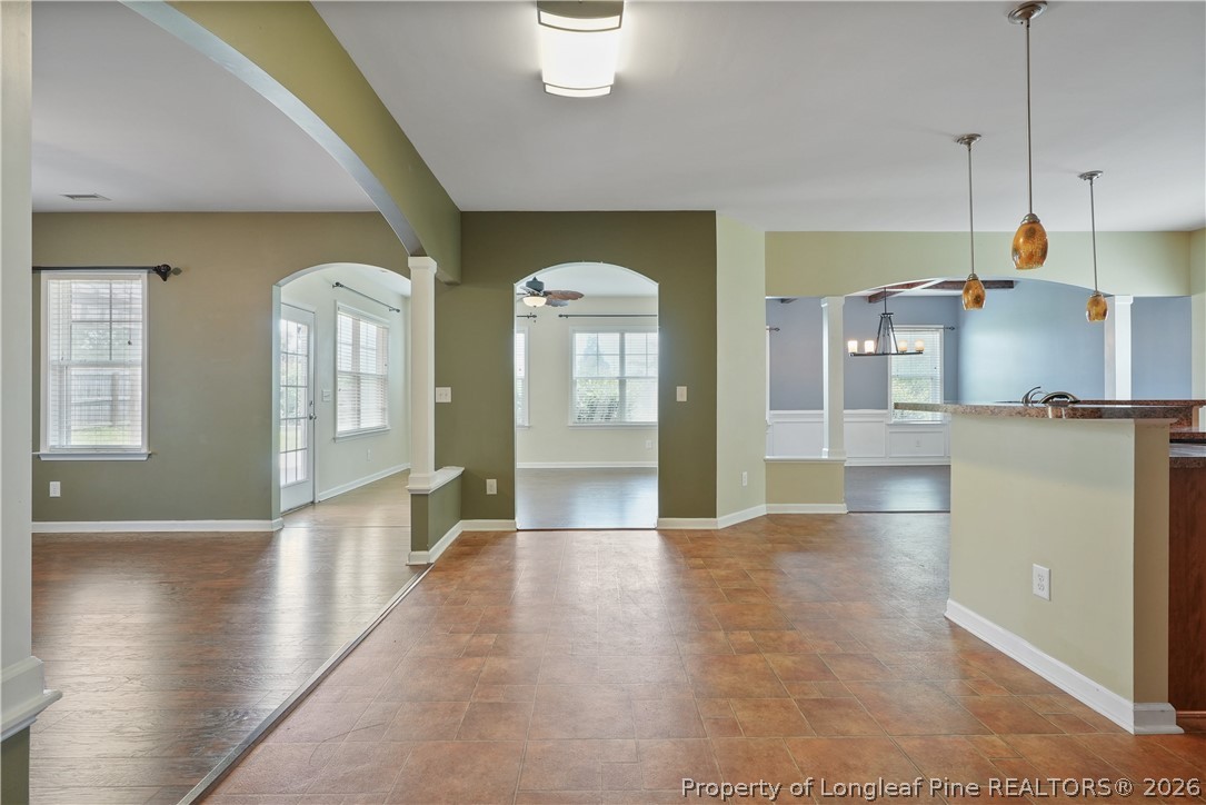 415 Highgrove Drive Spring Lake, NC 28390 - Photo 12 of 39 a view of a kitchen with a sink and dishwasher a refrigerator with wooden floor
