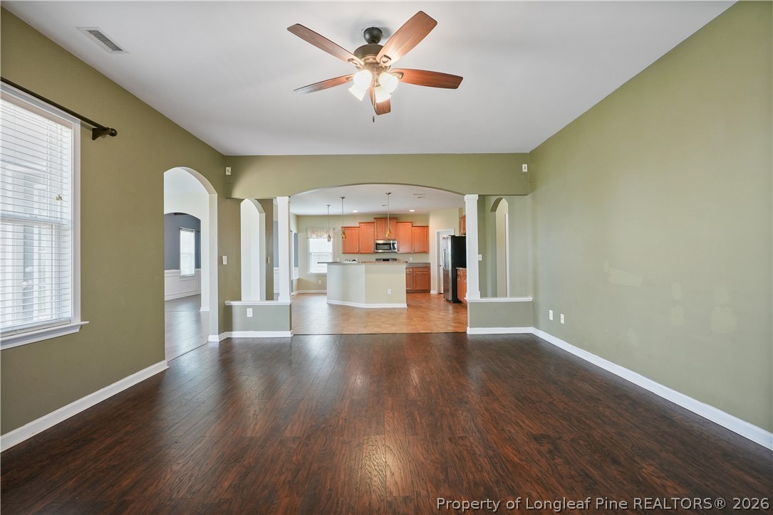 415 Highgrove Drive Spring Lake, NC 28390 - Photo 14 of 39 a view of an empty room with wooden floor and a window