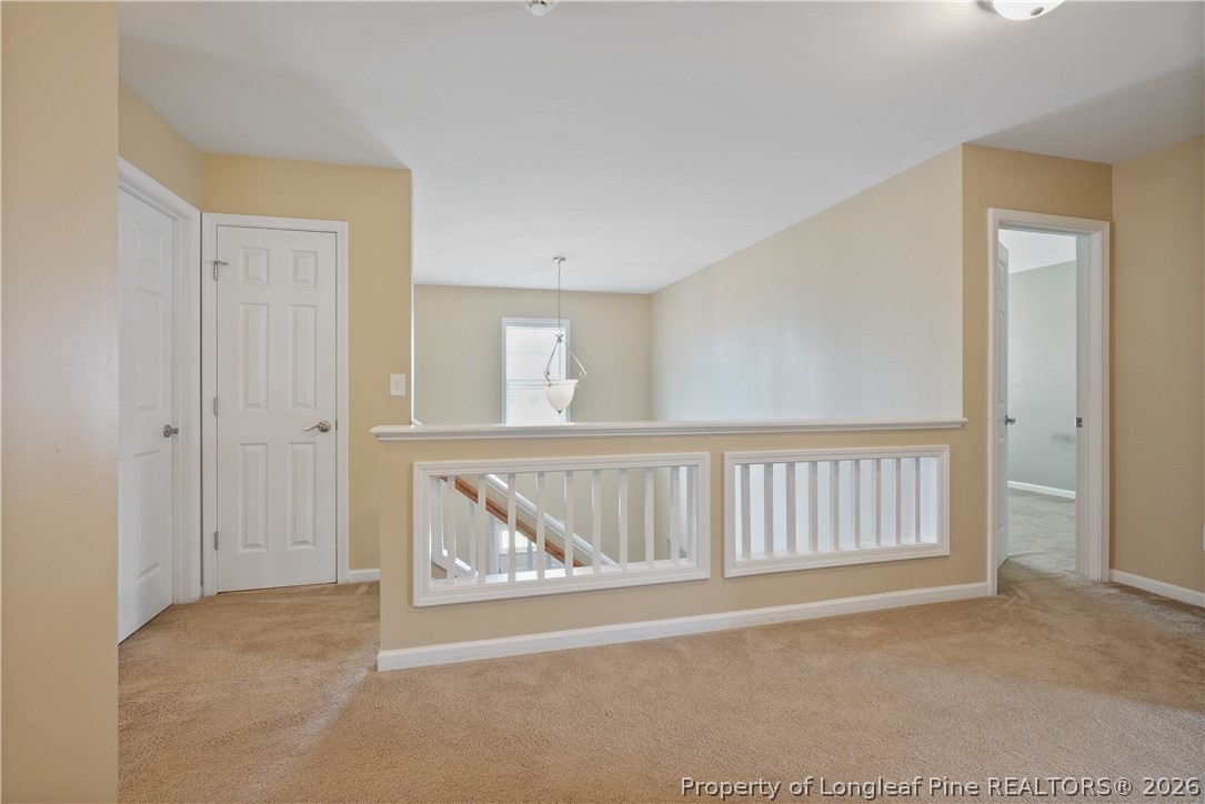 415 Highgrove Drive Spring Lake, NC 28390 - Photo 17 of 39 a view of an empty room with wooden floor and a window