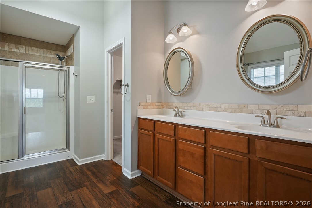 415 Highgrove Drive Spring Lake, NC 28390 - Photo 19 of 39 a bathroom with a double vanity sink and a mirror