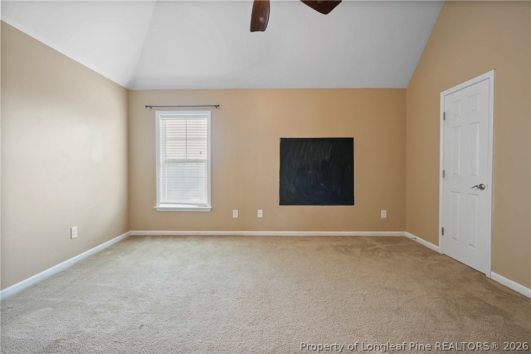415 Highgrove Drive Spring Lake, NC 28390 - Photo 24 of 39 a view of an empty room with window and wooden floor