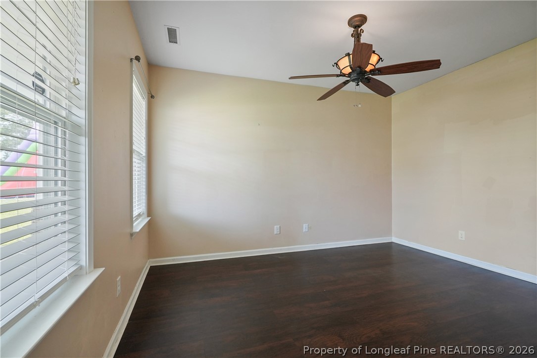 415 Highgrove Drive Spring Lake, NC 28390 - Photo 6 of 39 a view of a room with a window and a ceiling fan