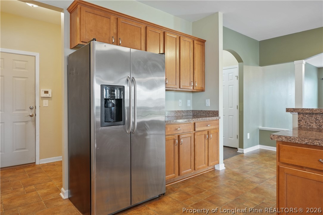 415 Highgrove Drive Spring Lake, NC 28390 - Photo 10 of 39 a kitchen with stainless steel appliances granite countertop a refrigerator and a stove